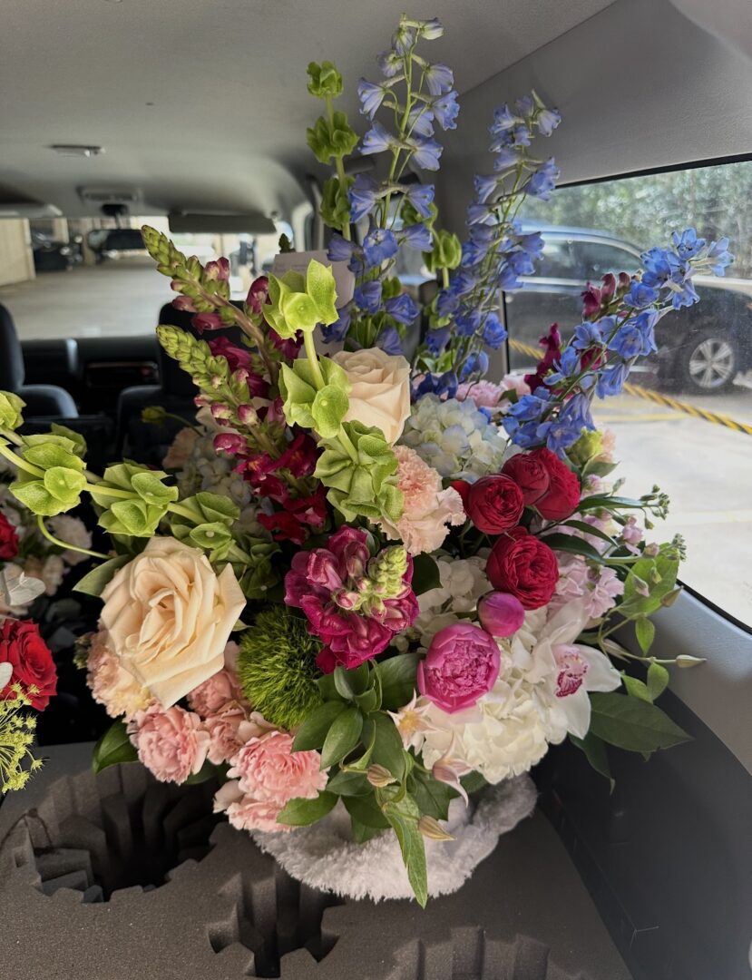 Large colorful floral bouquet in car