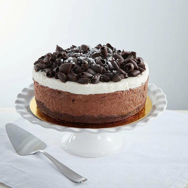 Layered chocolate mousse cake with chocolate shavings