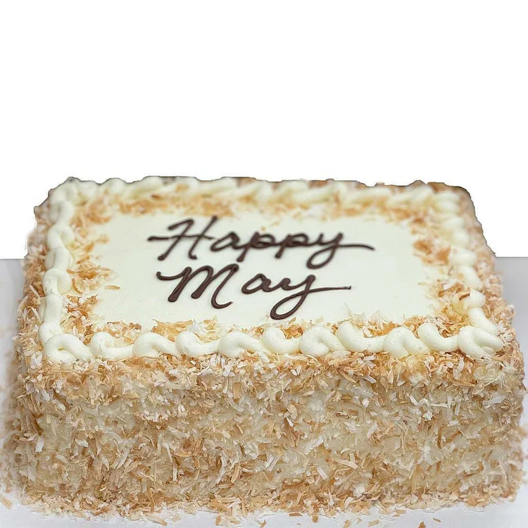 Rectangular coconut cake with "Happy May" icing