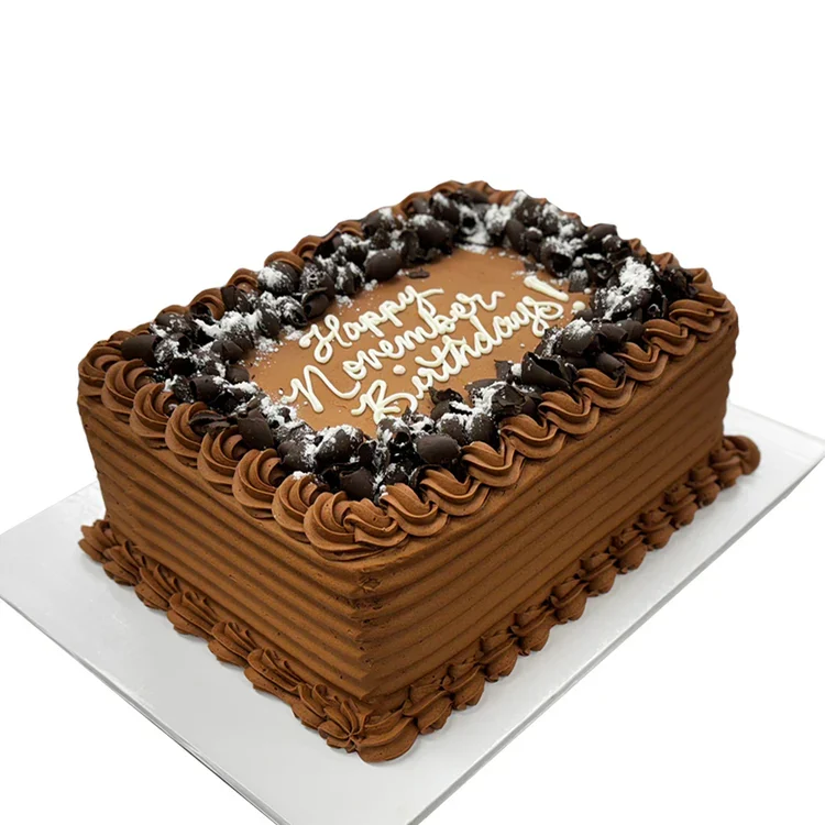Chocolate birthday cake with piped frosting