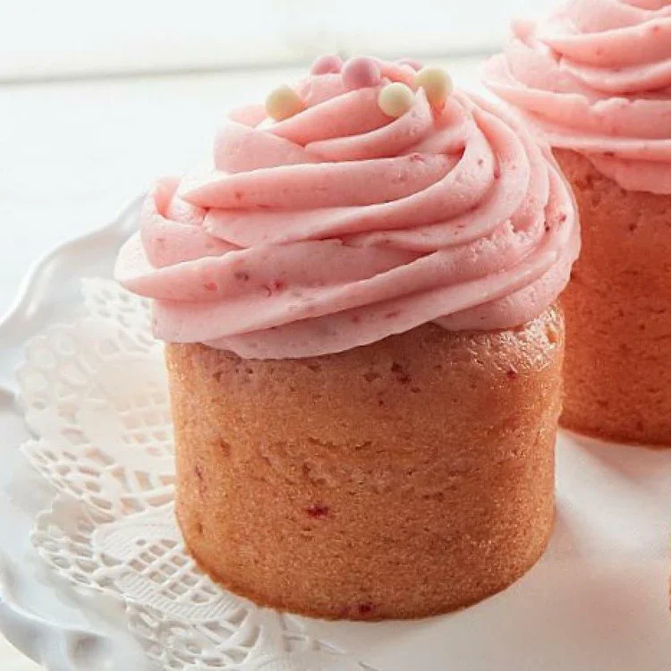 Pink frosted cupcakes with pearl sprinkles