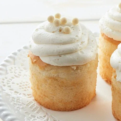 Mini vanilla cupcake with white frosting pearls